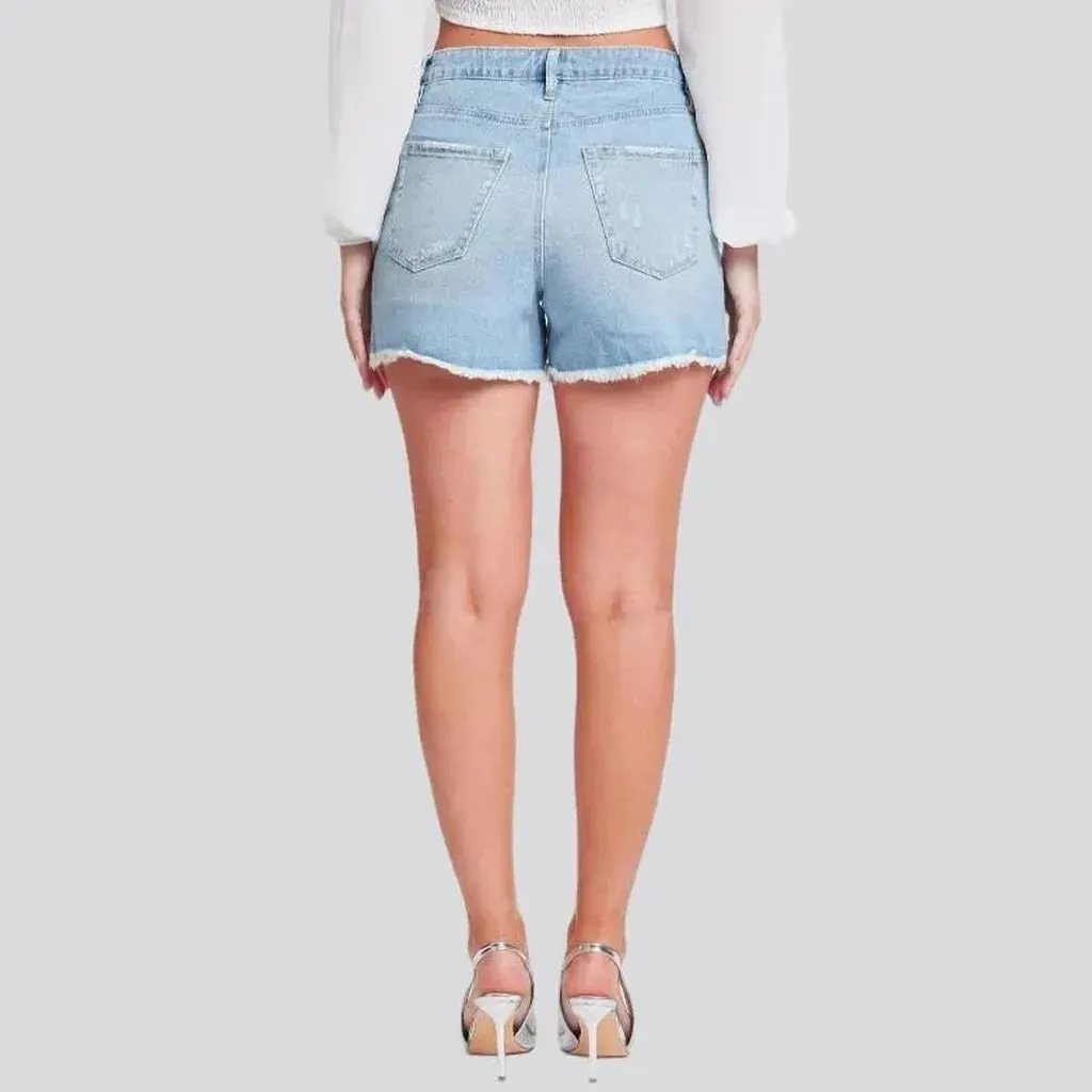 Distressed light-wash denim shorts for women